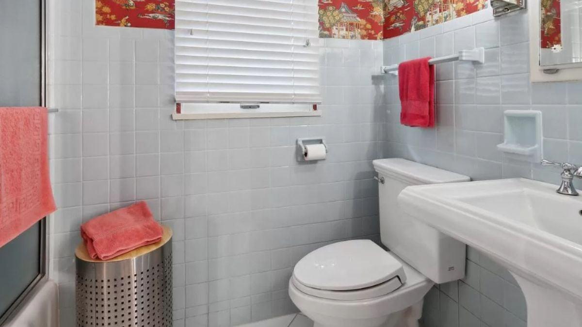 Vintage Bathroom Charm with Bold Red Accents