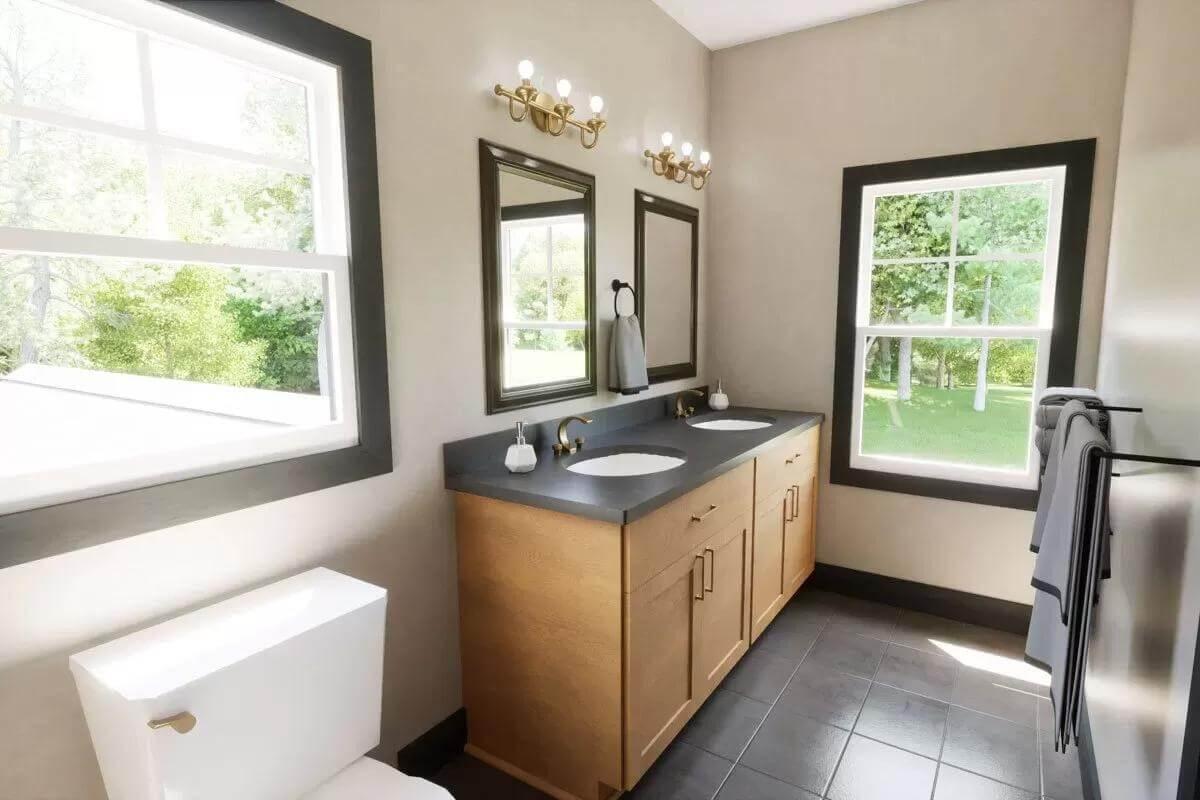 Double Vanity Bathroom Featuring Brass Fixtures