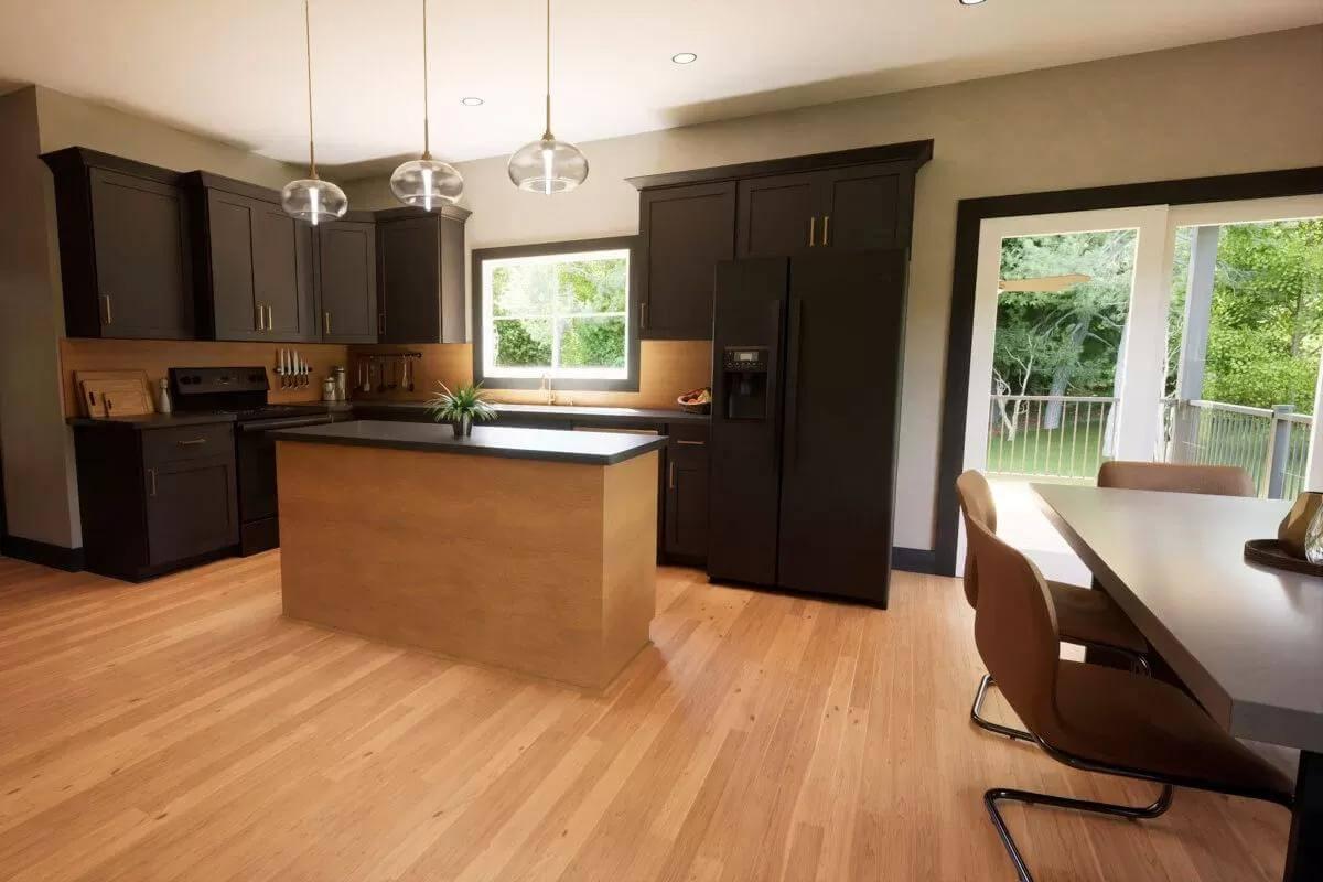 Sleek Kitchen with Dark Cabinetry and Bright Wooden Floors