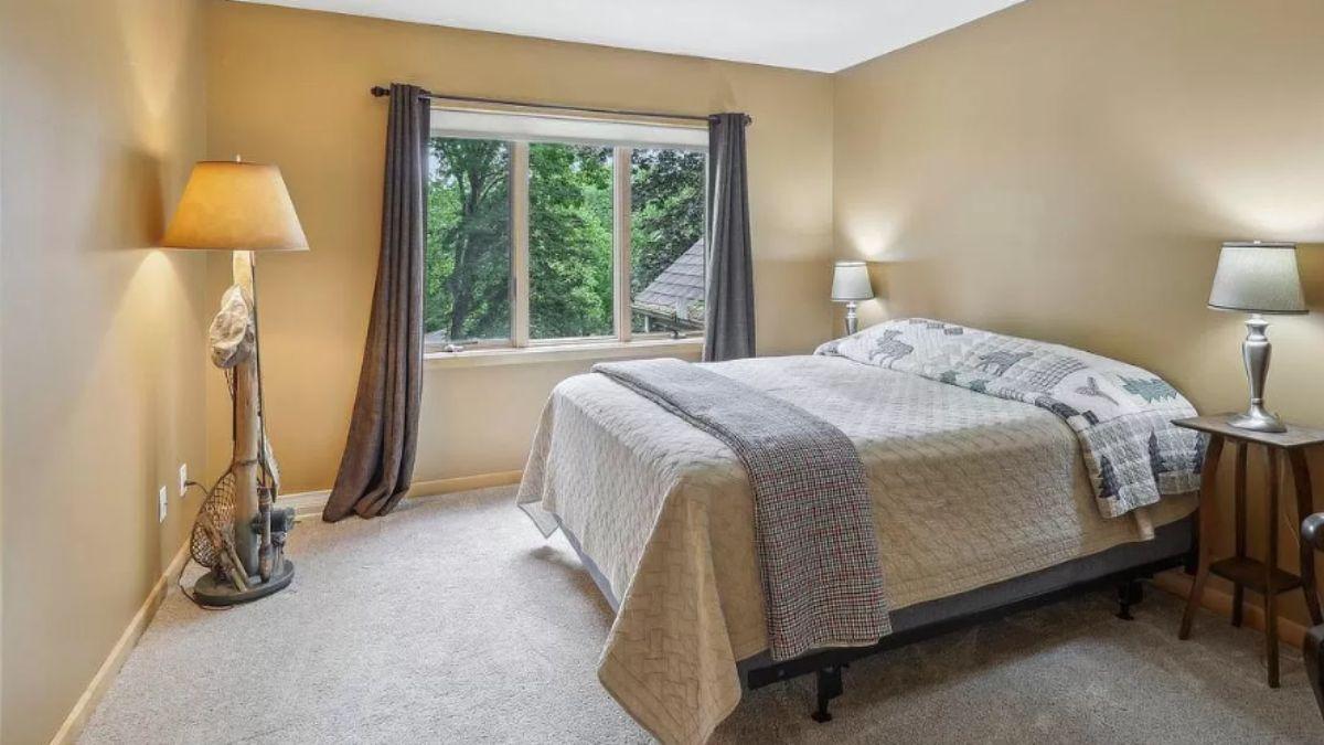 Simple Craftsman Bedroom with Natural Views and Rustic Lamp