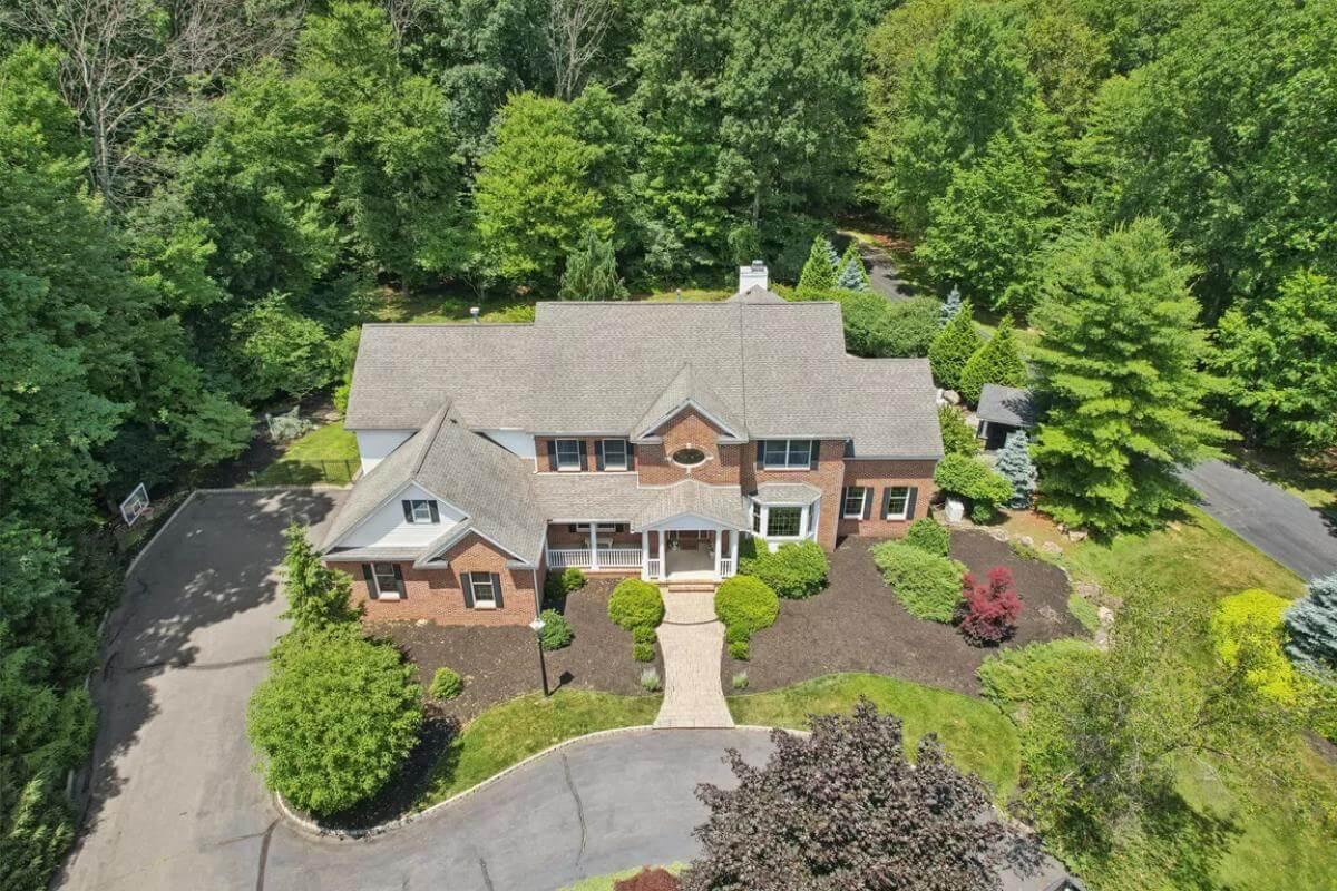 Classic Brick Home Nestled in Lush Greenery