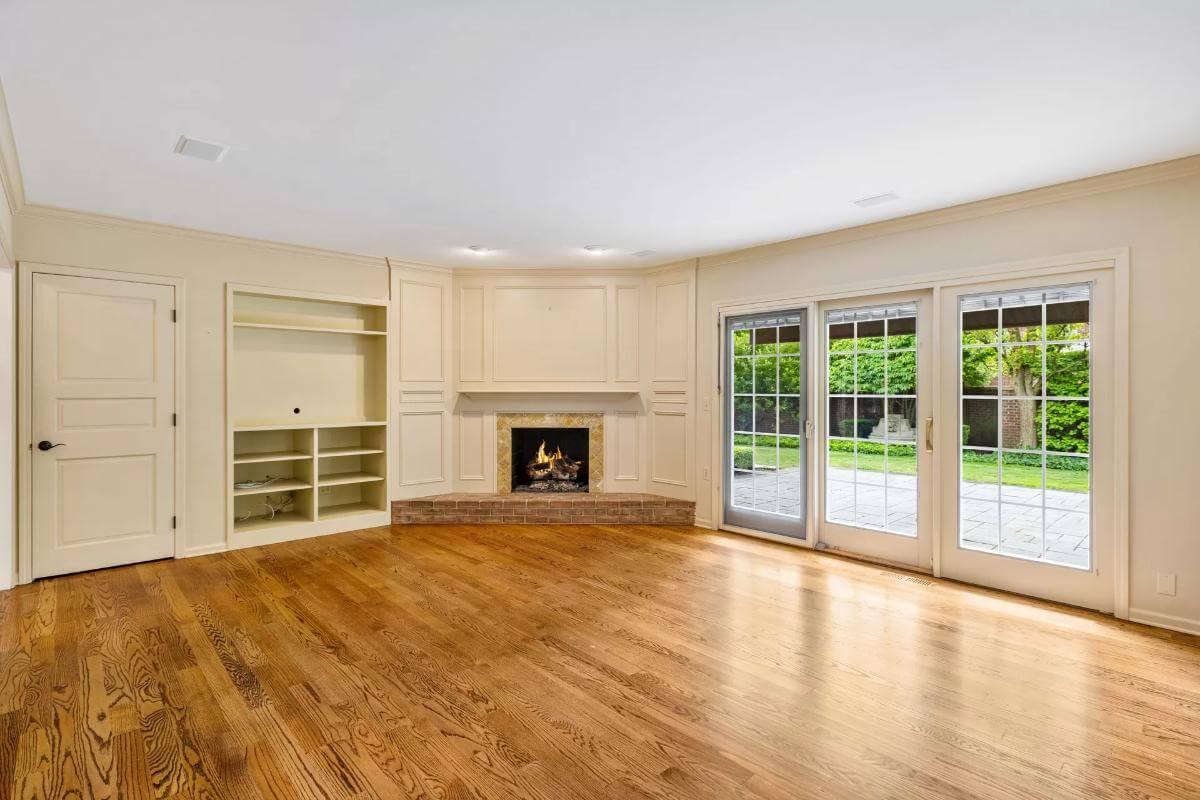 Sunny Family Room with Built-In Shelves and Garden Views