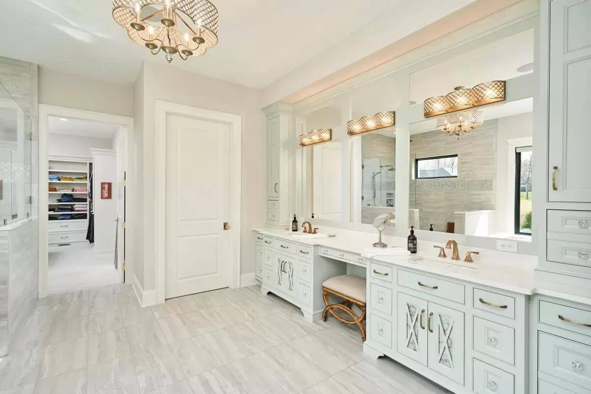 Luxurious Bathroom with Custom Vanity and Sparkling Chandeliers