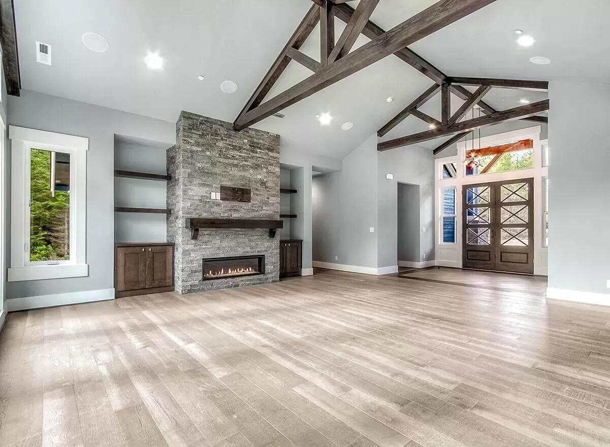 Experience the Exposed Timber Trusses in This Spacious Family Room