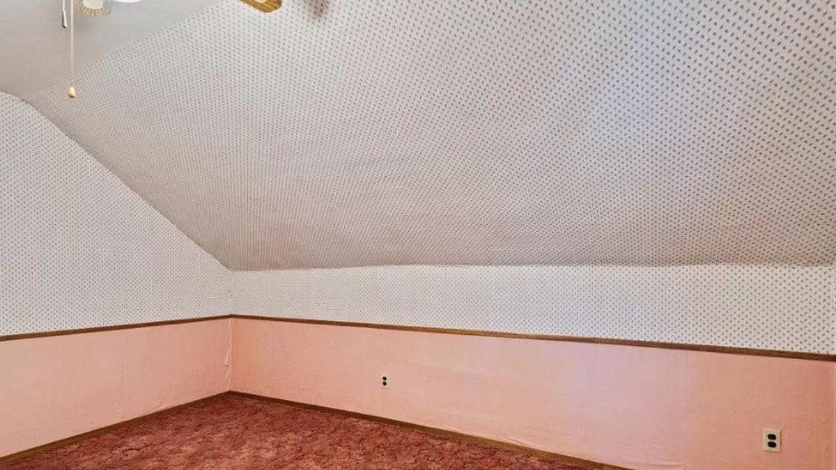 Spot the Retro Wallpaper in This Cozy Sloped Ceiling Room