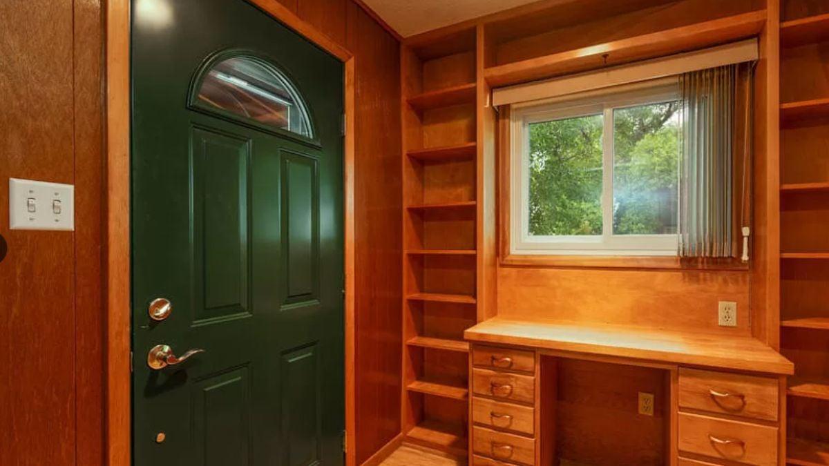 Charming Entryway Featuring Built-In Wooden Shelving
