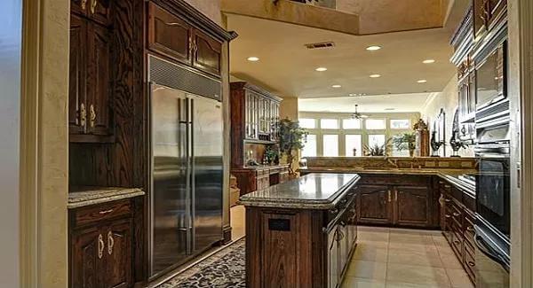 Check Out the Statement Island in This Wood-Rich Kitchen