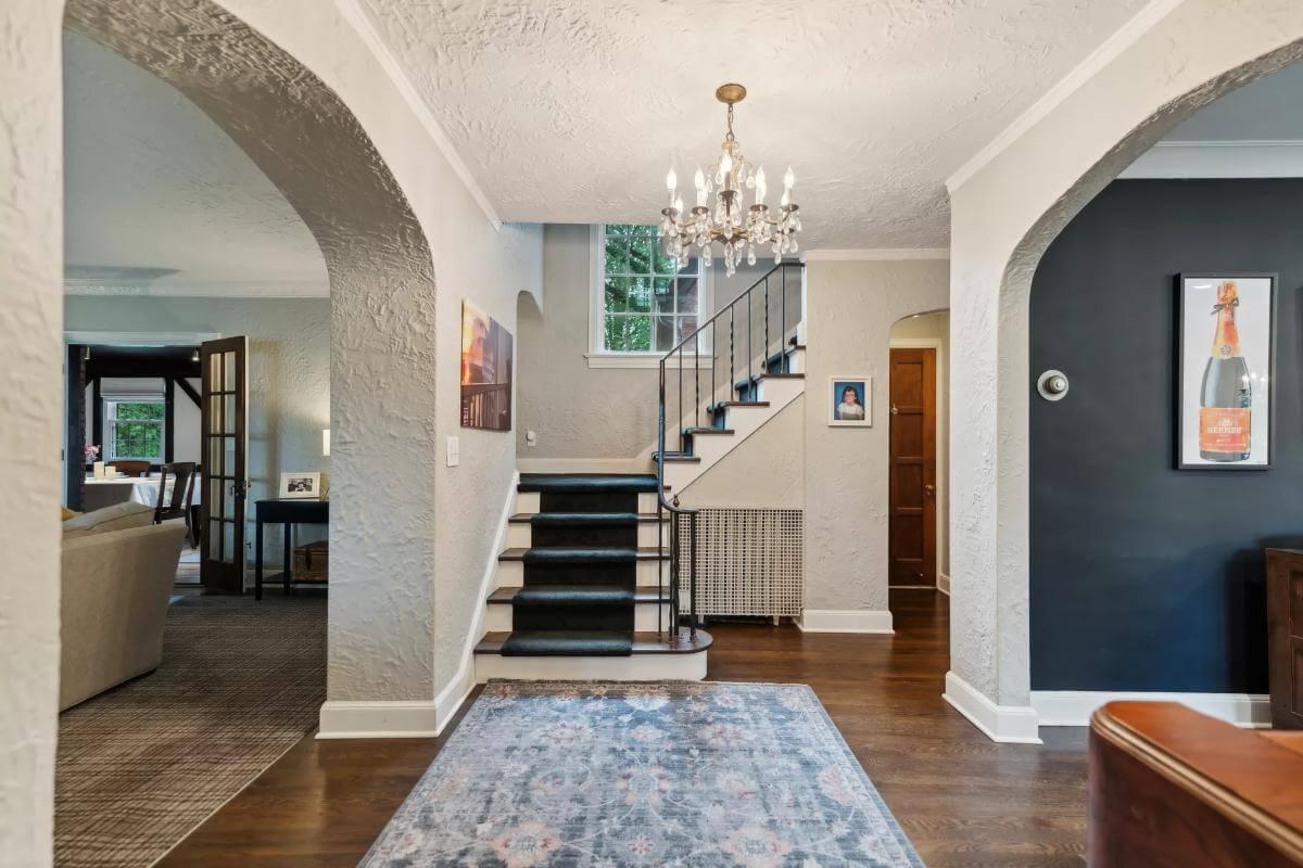 Step Into This Welcoming Foyer with Elegant Staircase