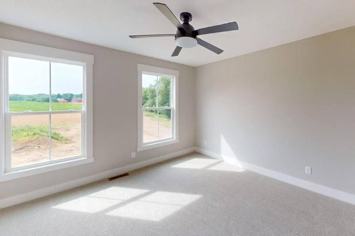 Sunny Room with Peaceful Views and Contemporary Ceiling Fan