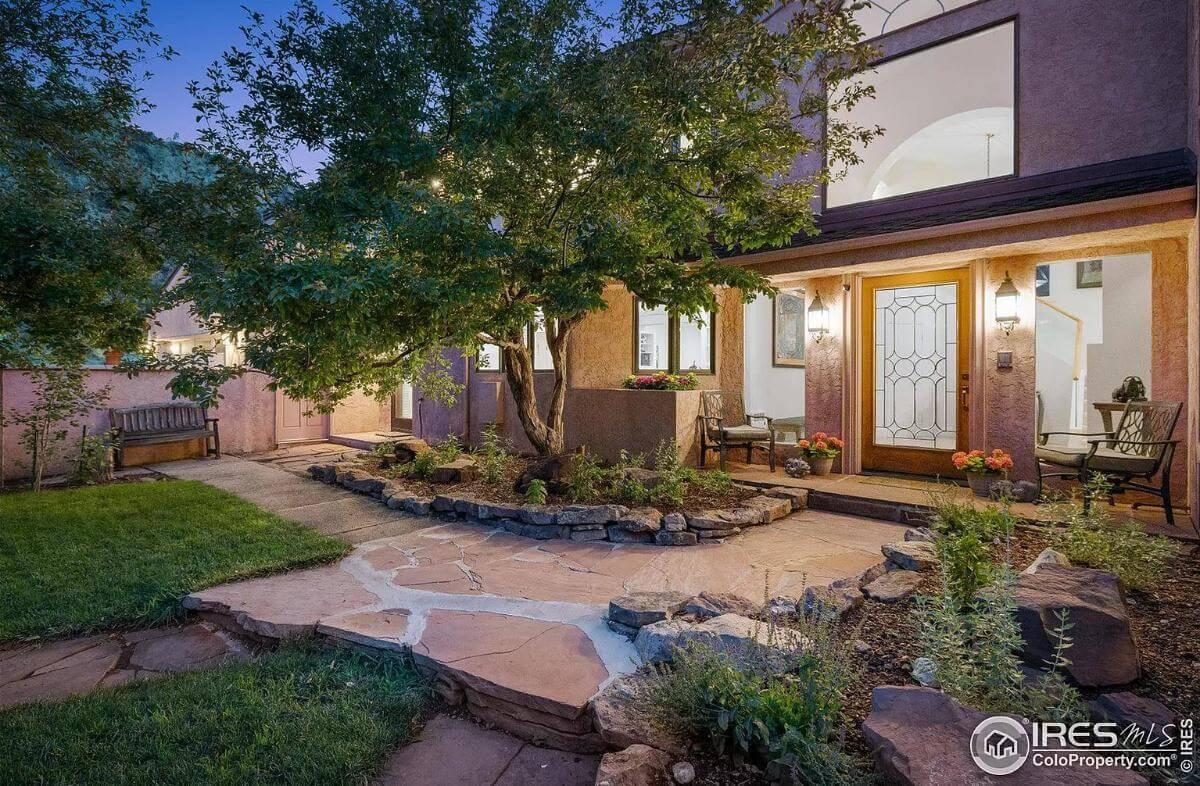 Inviting Front Entrance with a Rustic Stone Pathway