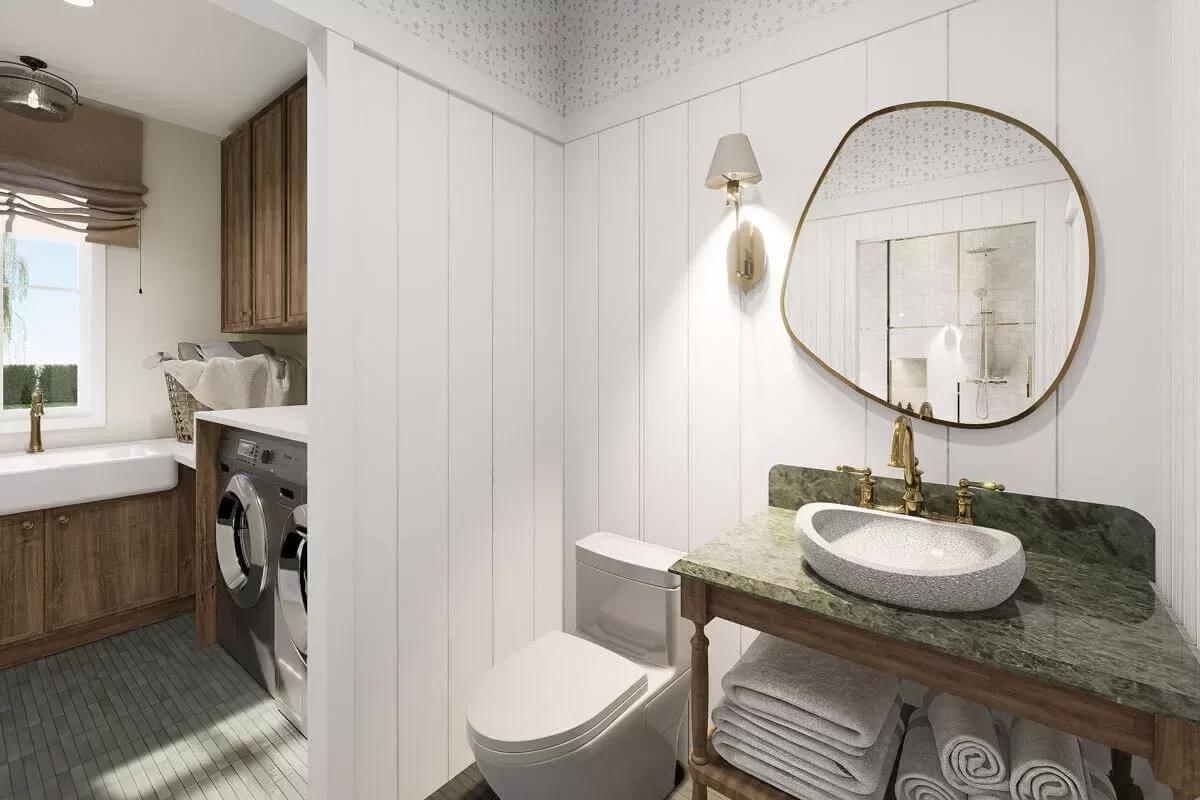 Check Out How the Laundry Area Adjoins This Elegant Powder Room