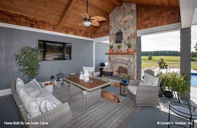 Charming Craftsman Patio with Stone Fireplace and Rustic Details