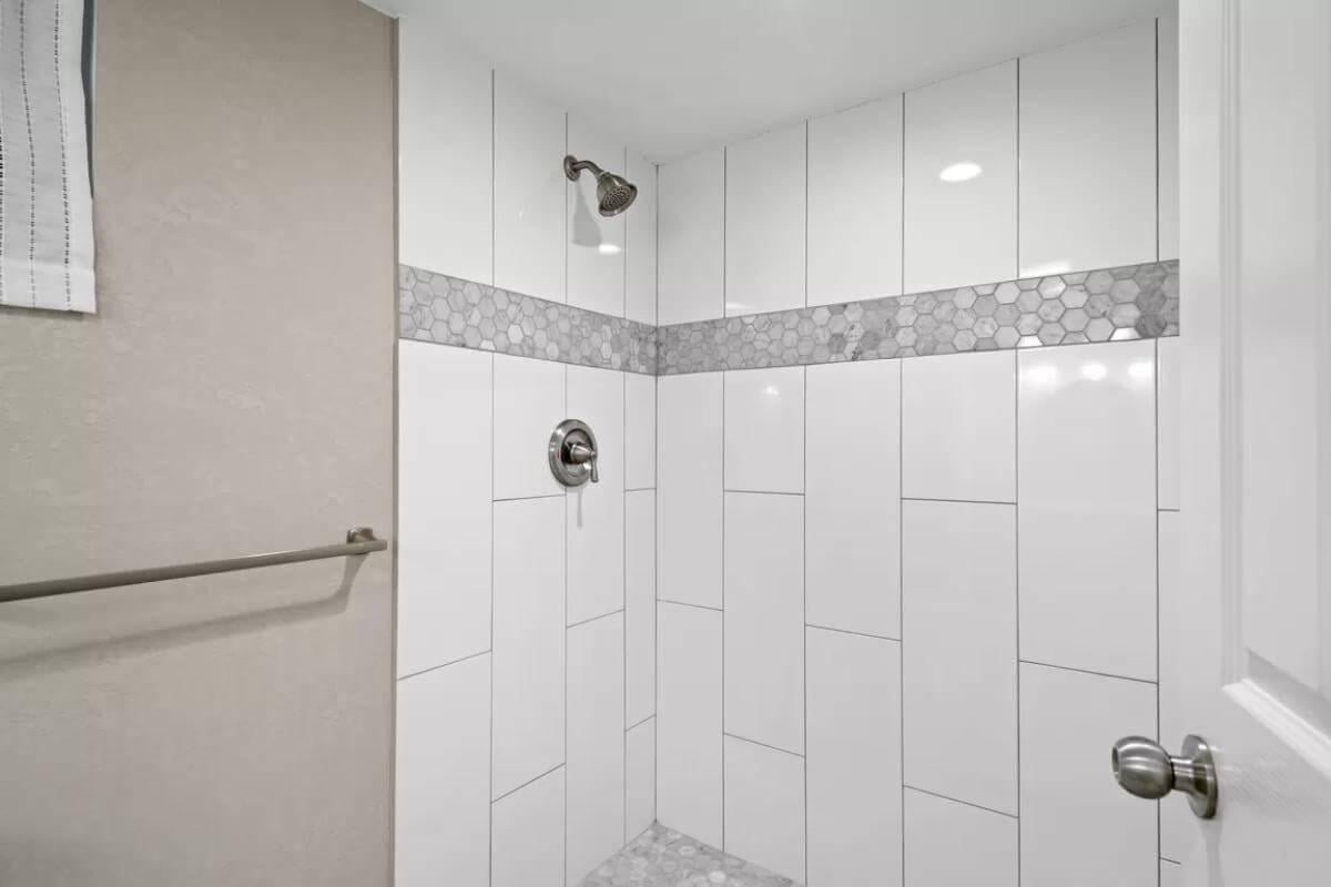 Timeless Shower Design with Hexagonal Tile Accent