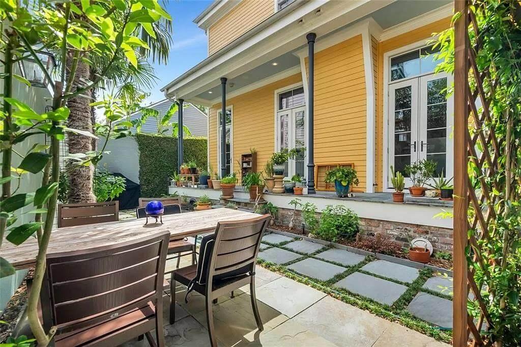 Step into This Vibrant Garden Patio with Slate Pathway