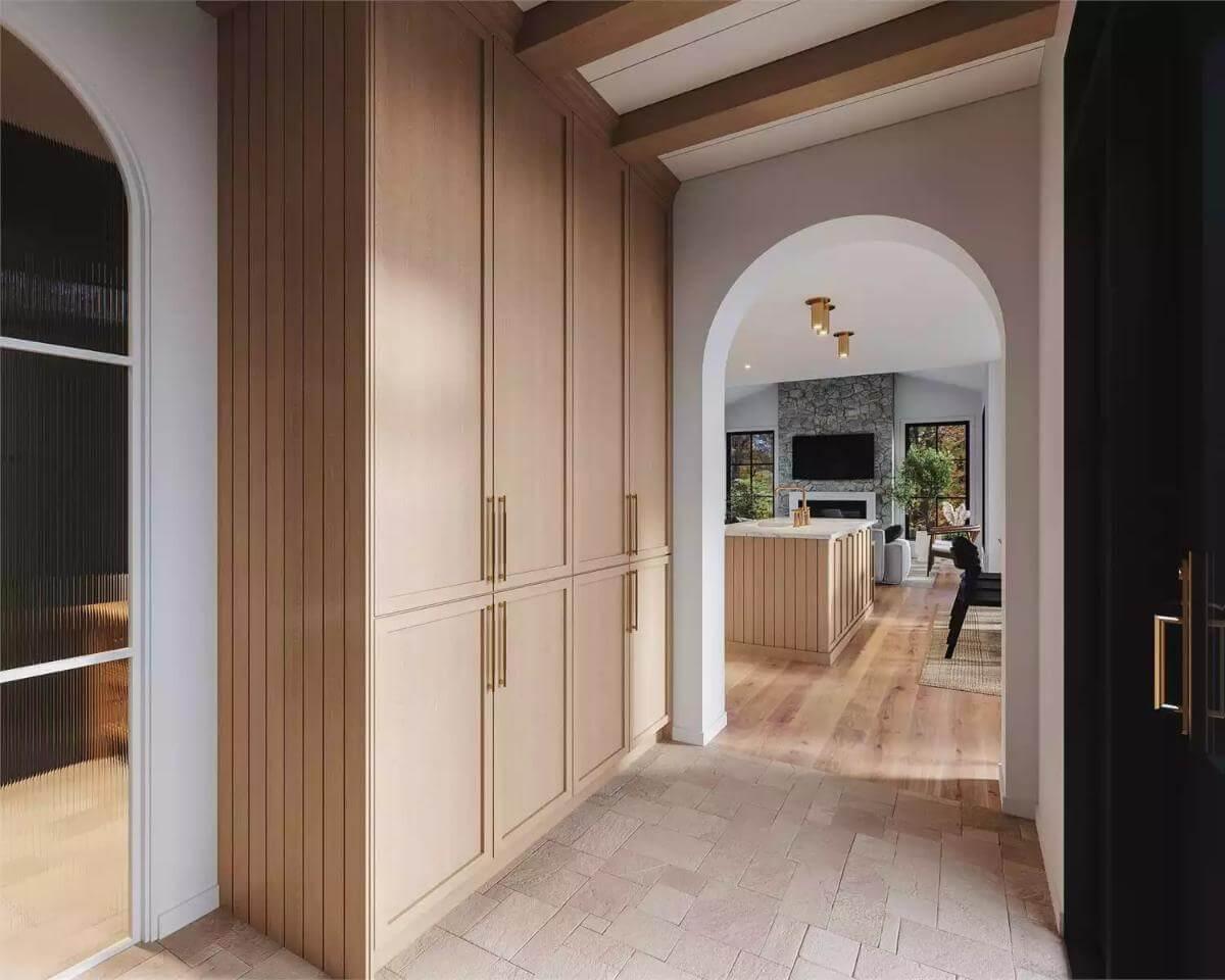 Spotlight on Sleek Built-In Cabinets in This Arched Hallway
