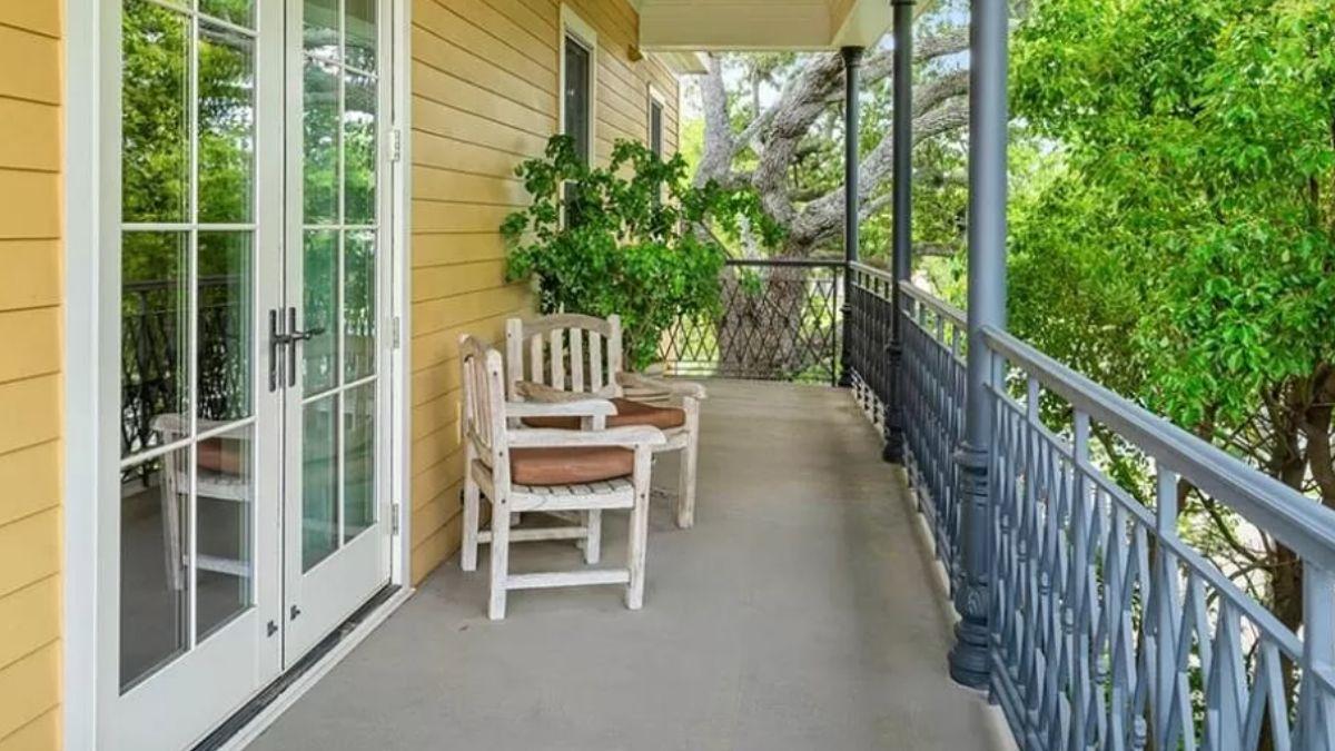 Relax on This Southern Balcony with Its Crafted Wooden Bench
