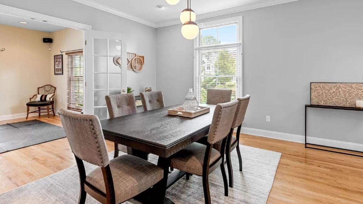 Dining Room with Contemporary Pendant Lighting and Textured Wall Art
