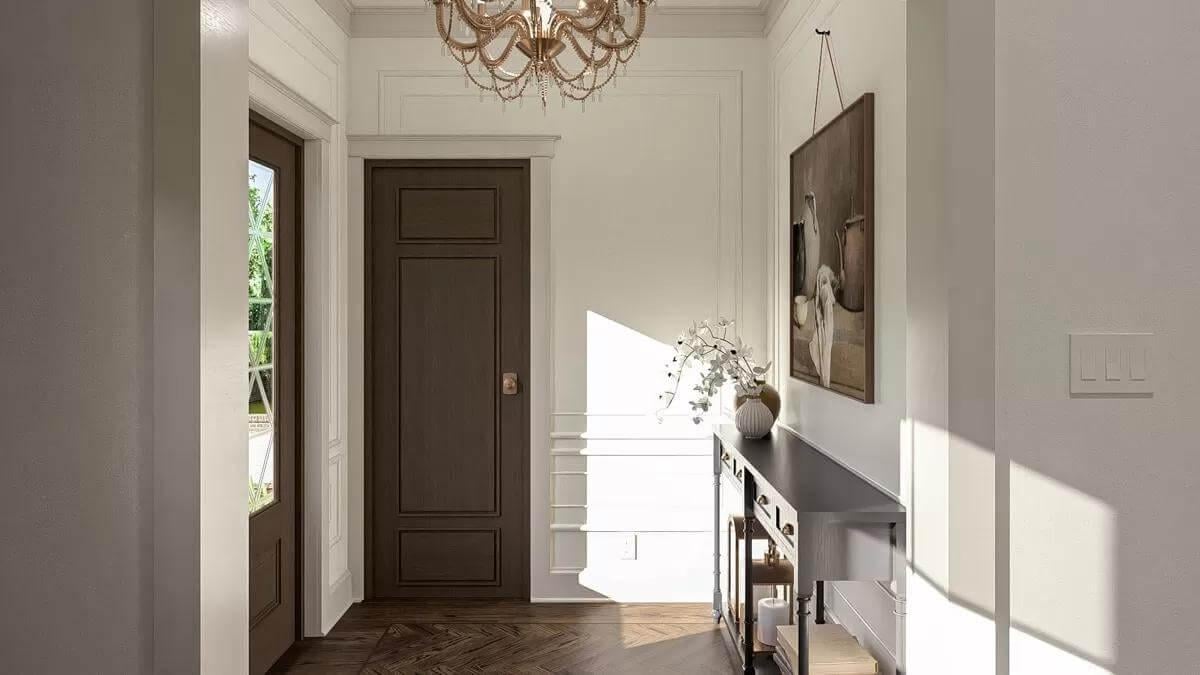 Elegant Entryway with a Statement Chandelier and Dark Wood Accents
