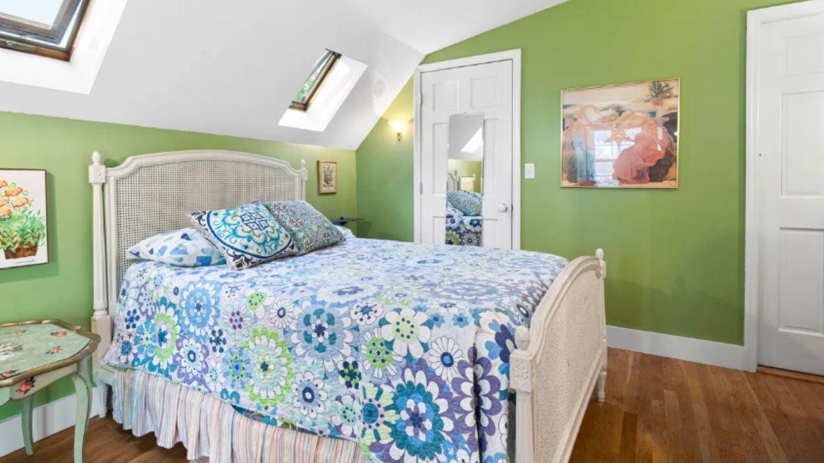 Vibrant Bedroom with Skylights and Floral Touches