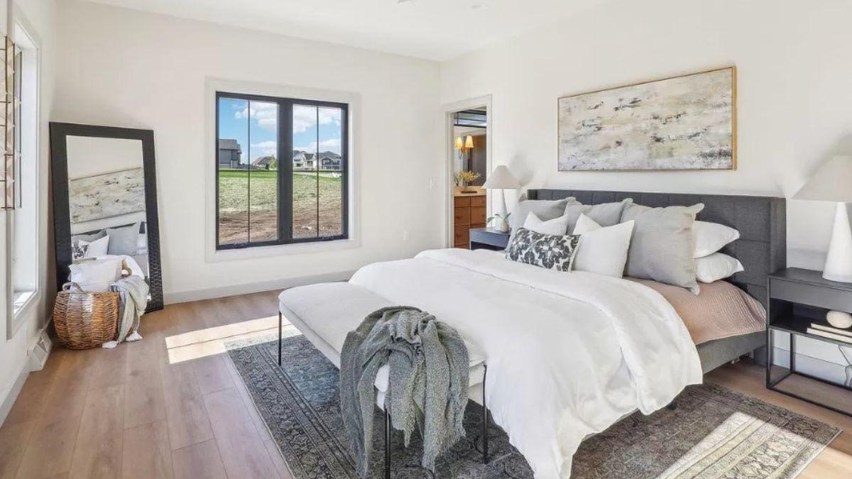 Tranquil Bedroom Retreat with Textured Layering and Scenic Views