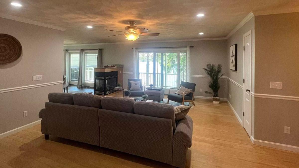 Gather in the Bright Living Room with a Unique Double-Sided Fireplace