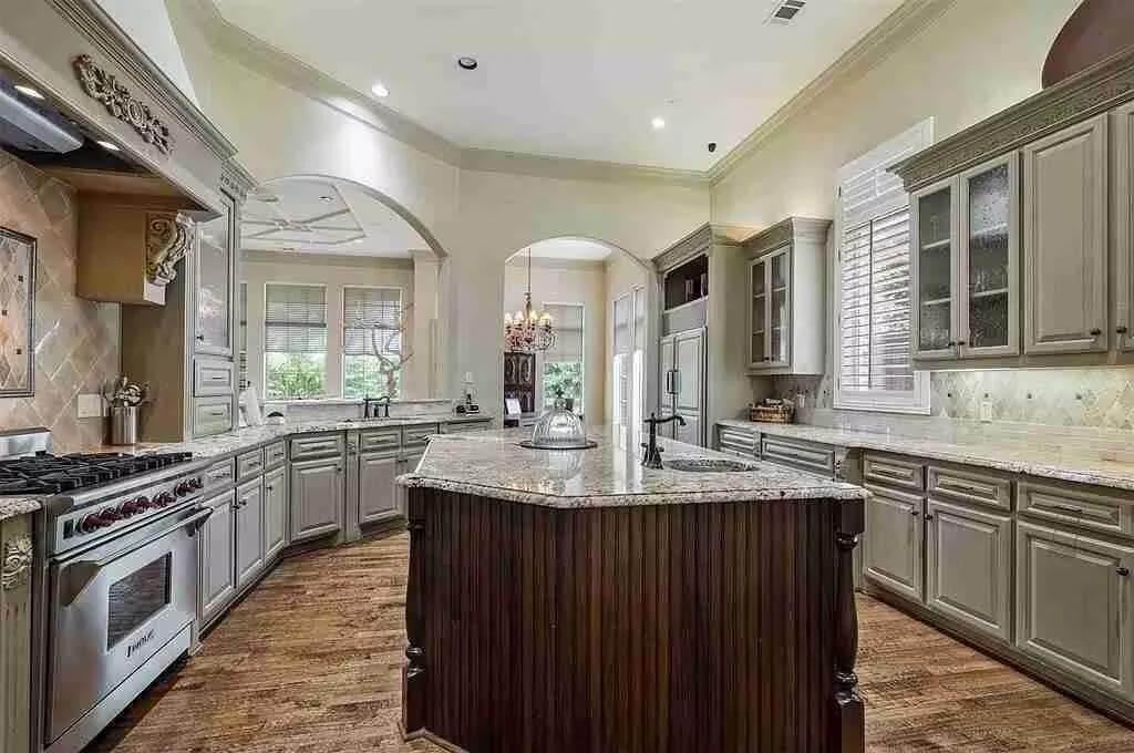 Check Out the Ornate Detailing on This Spacious Kitchen Island