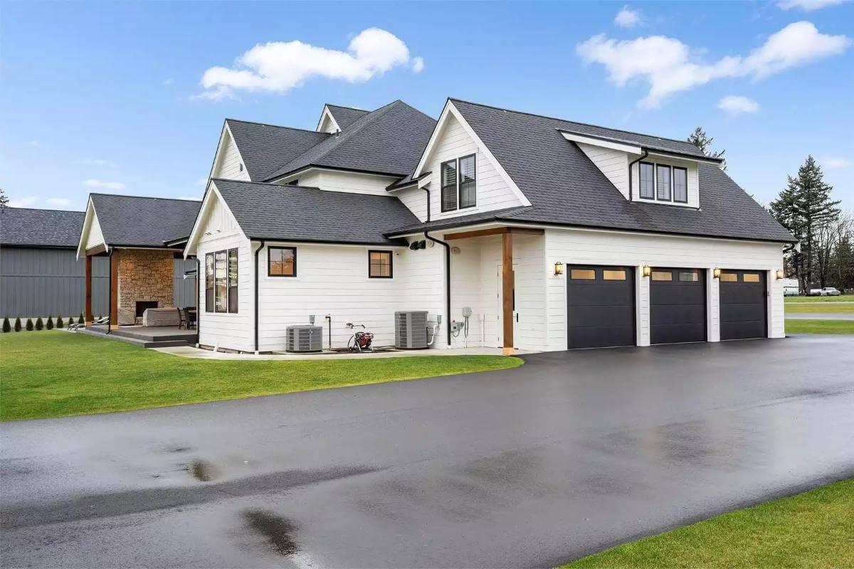 Craftsman Style Shines with Its Trio of Black Garage Doors