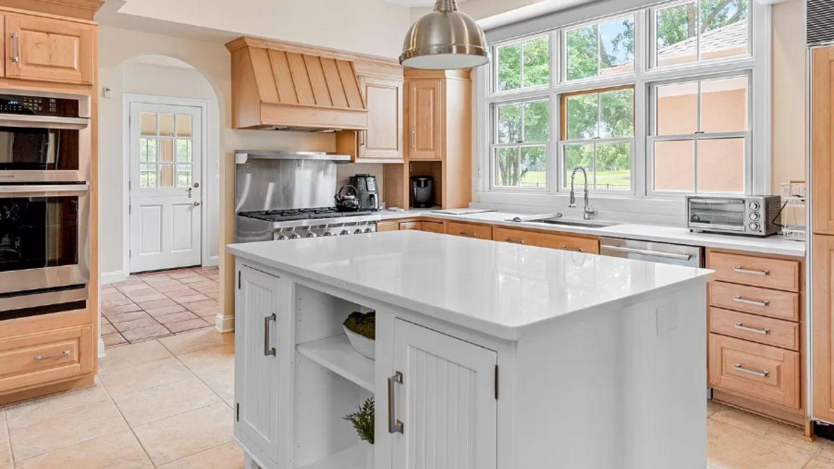 Wow, Look at the Expansive Island in this Bright Kitchen