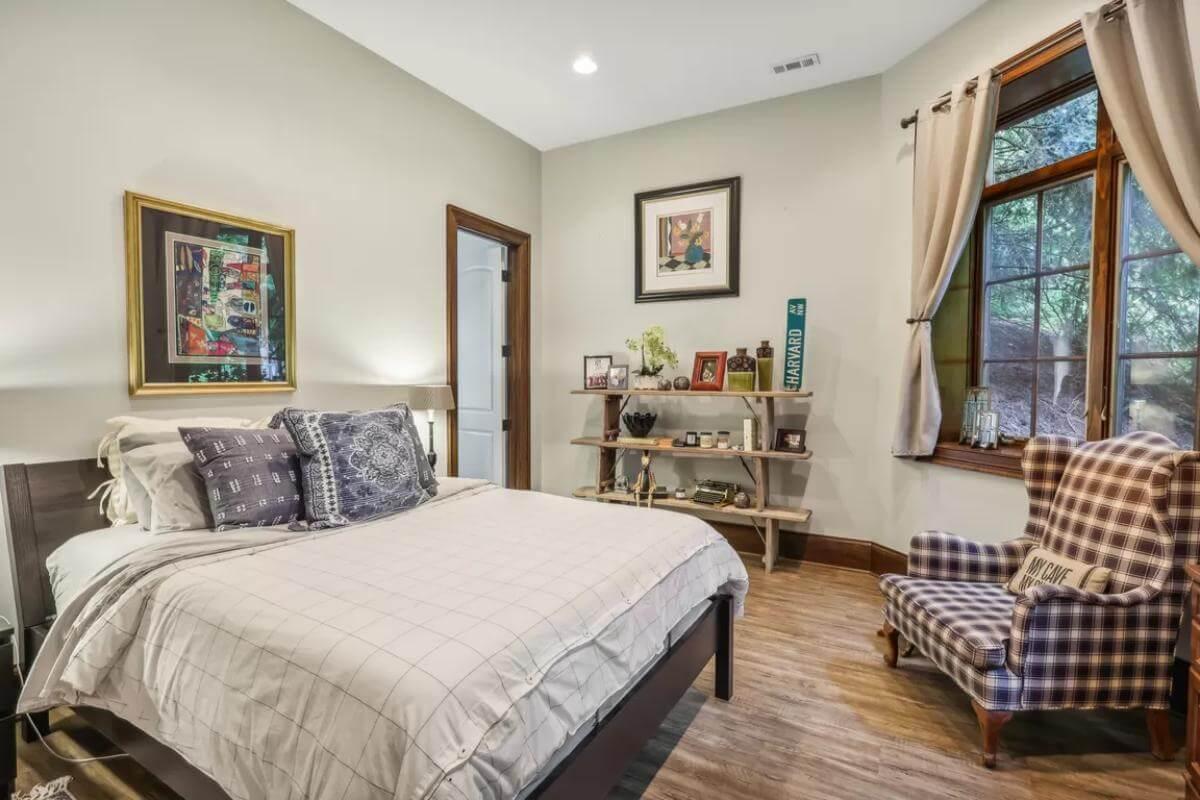 Soothing Bedroom with Unique Armchair and Wooden Shelves