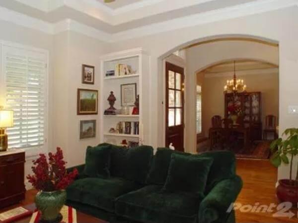 Elegant Flow from Living Room to Dining Room with Classic Built-In Shelves