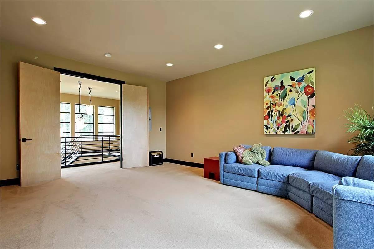 Flexible Bonus Room with Bold Artwork and Cozy Sectional