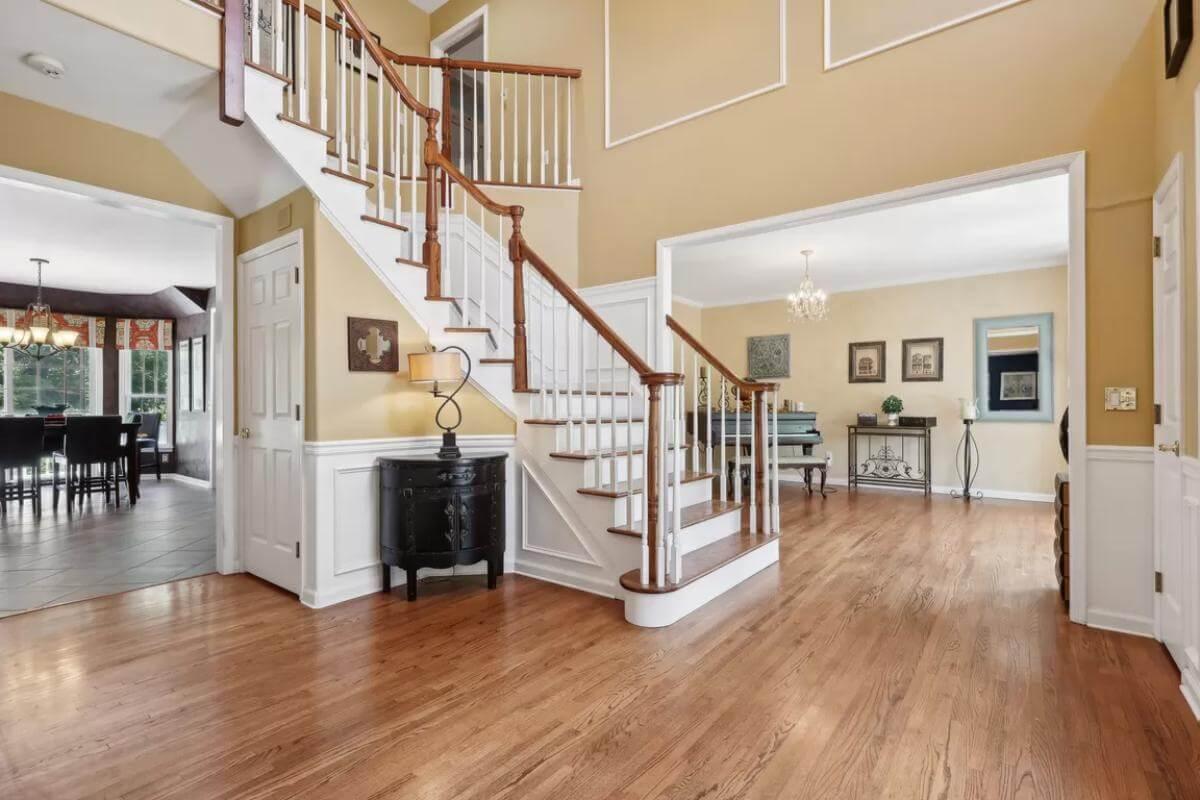 Elegant Staircase with Rich Wood Details and Inviting Flow
