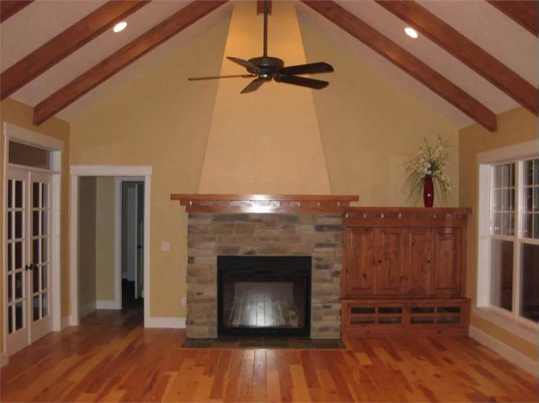 A Look Inside: Vaulted Ceilings and a Stone Fireplace Anchor the Living Room