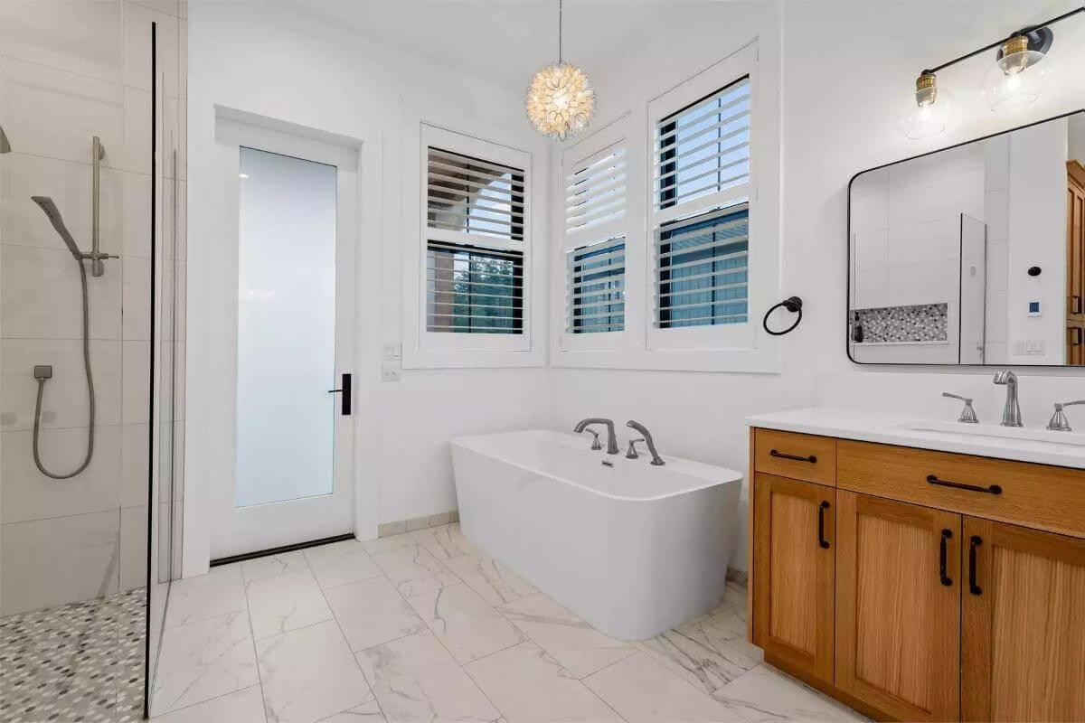 Modern Bath with Freestanding Tub and Warm Wood Accents