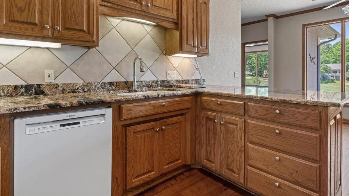 Natural Wood Kitchen Cabinets with Striking Granite Countertops