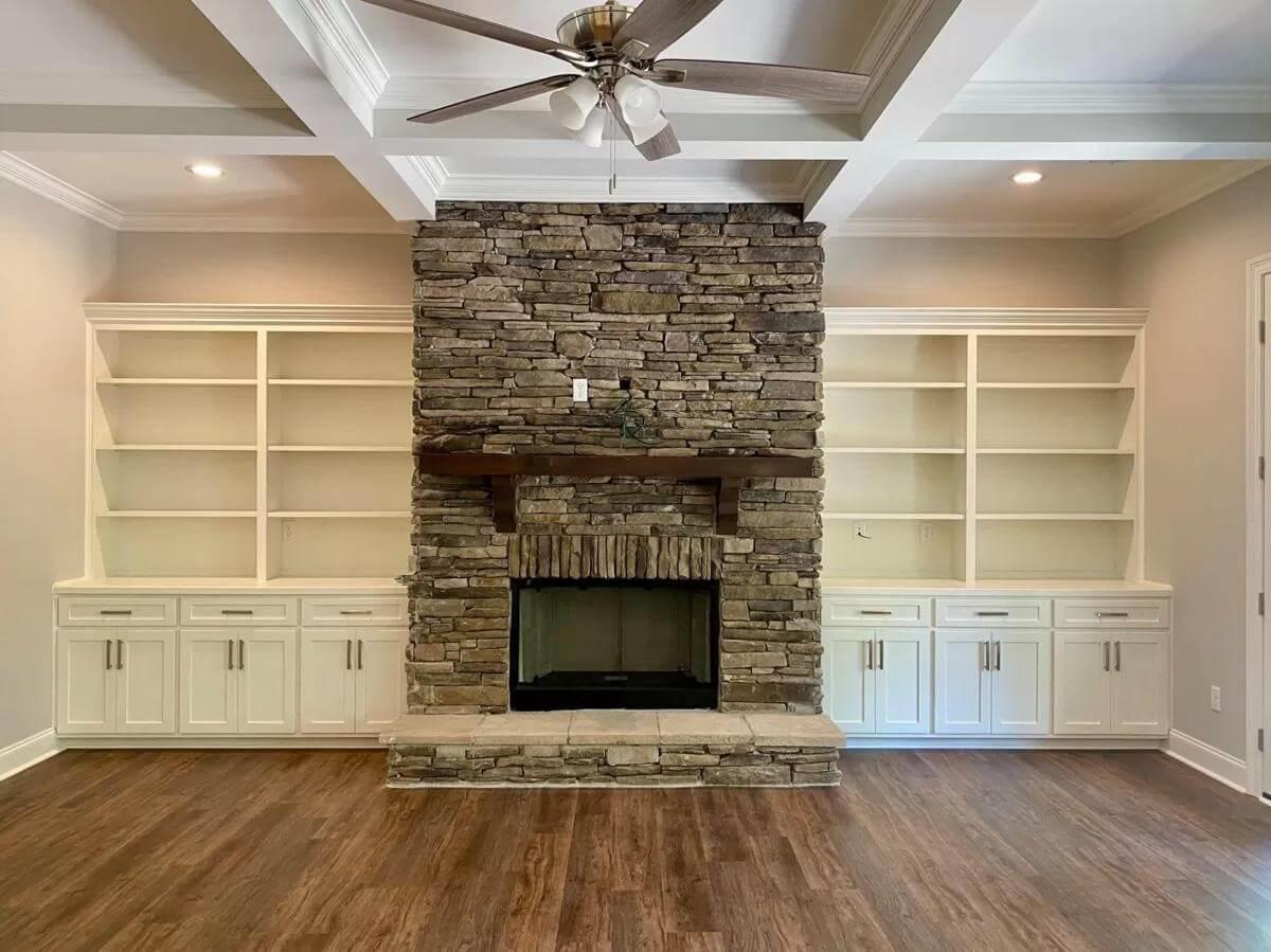 Admire the Stone Fireplace with Built-In Shelving