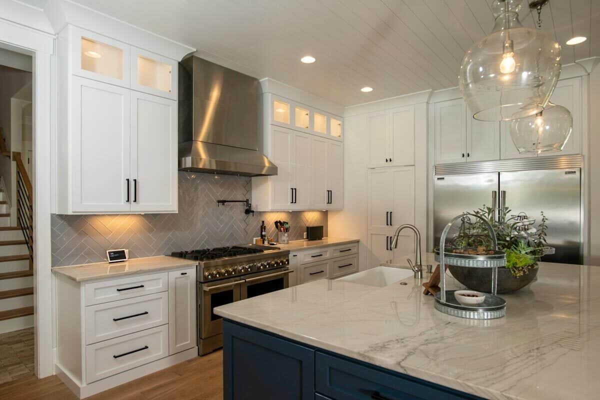 Sleek Gourmet Kitchen Featuring Herringbone Backsplash