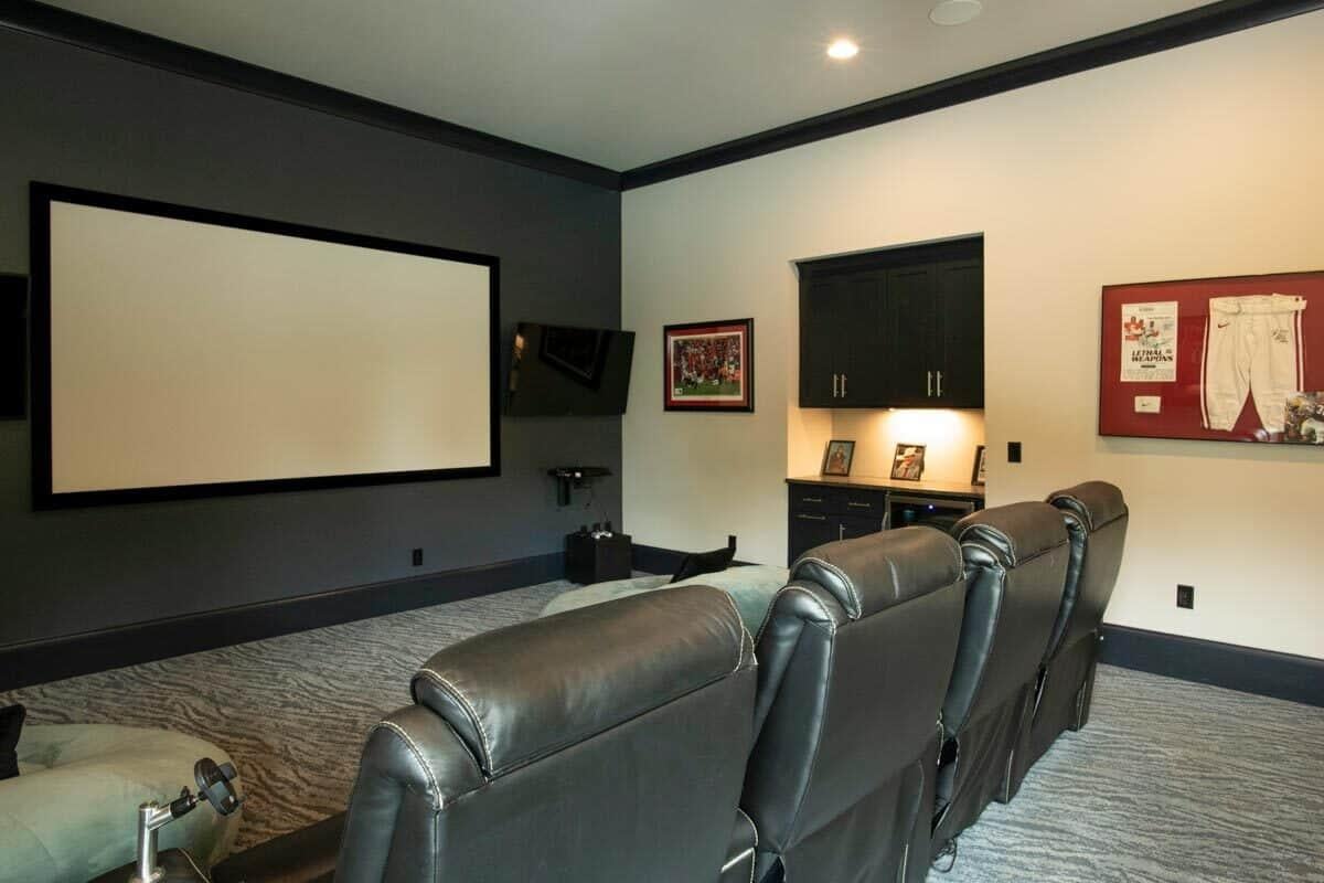 Settle into This Luxurious Home Theater with Leather Recliners