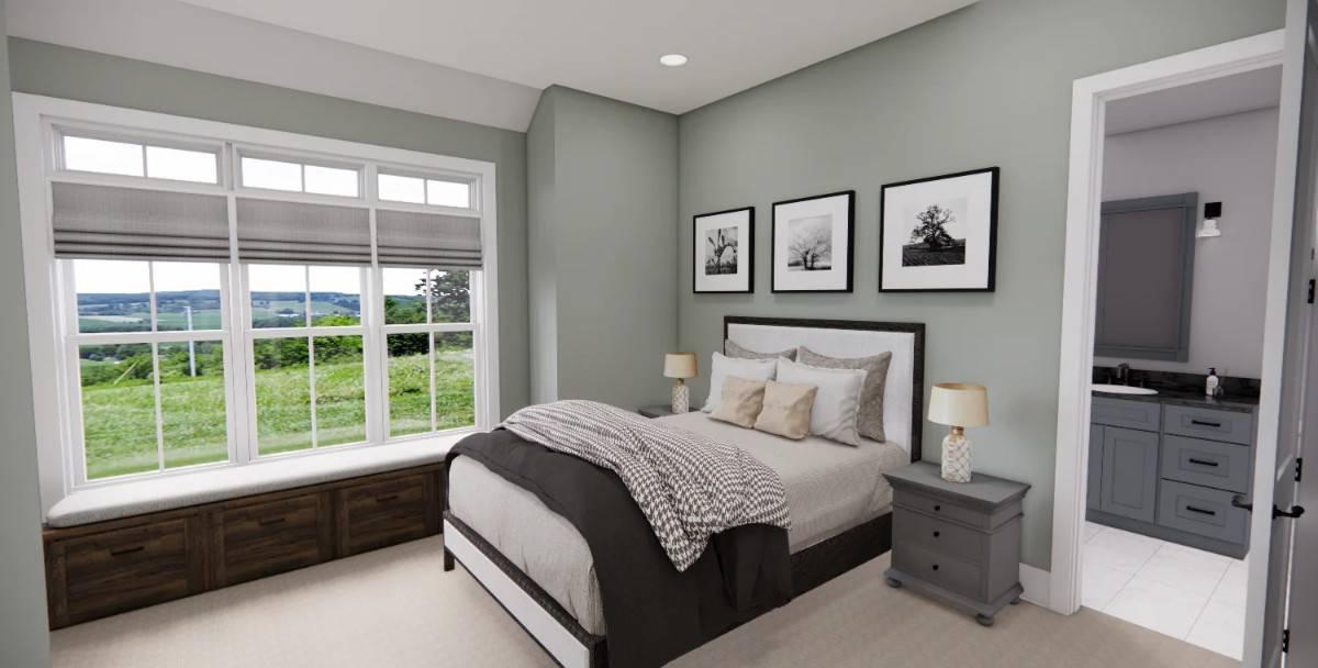 Check Out This Bright Bedroom with a Window Seat and Scenic Views