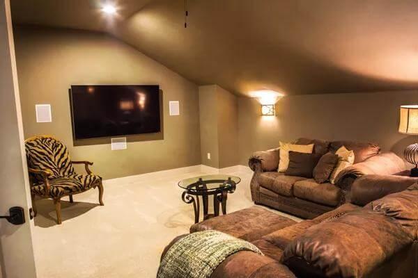 Relax in This Cozy Media Room with Plush Seating and Ambient Lighting