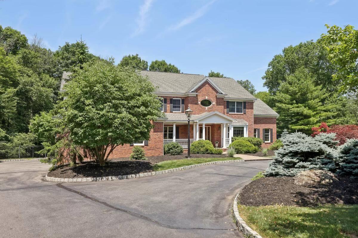 Charming Colonial with Brick Facade and a Stately Front Porch