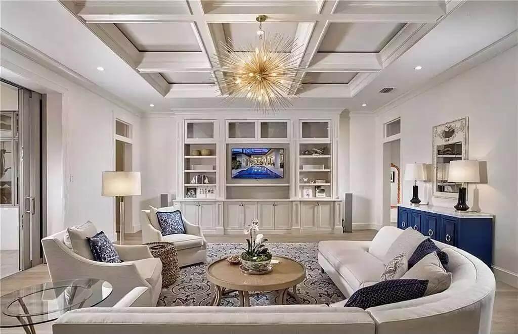 Living Room with Coffered Ceiling and Striking Starburst Chandelier