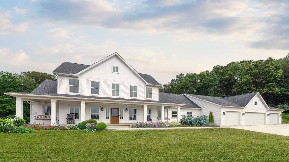 Classic Farmhouse Vibes with a Wraparound Porch Just Begging for Rocking Chairs
