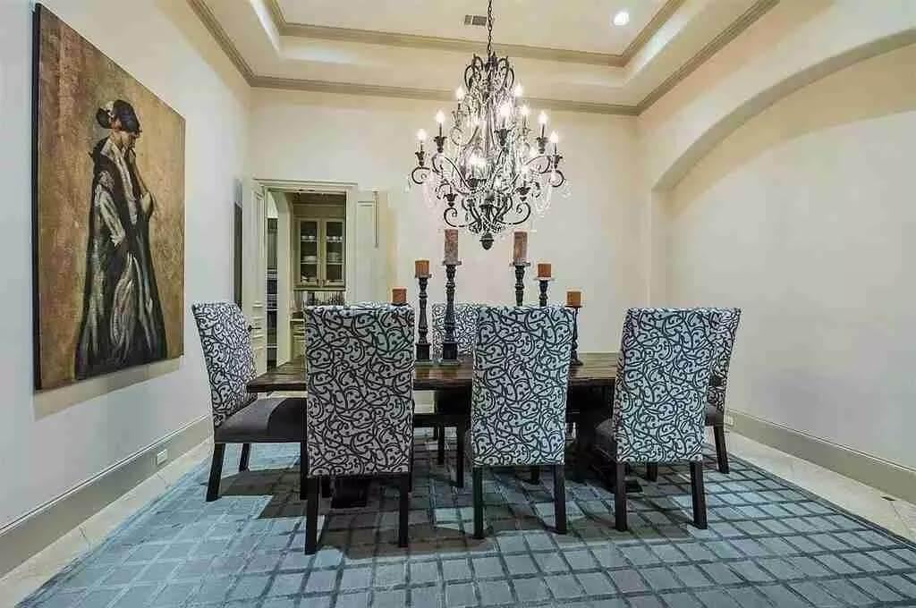 Notice the Ornate Chandelier Illuminating This Elegant Dining Room