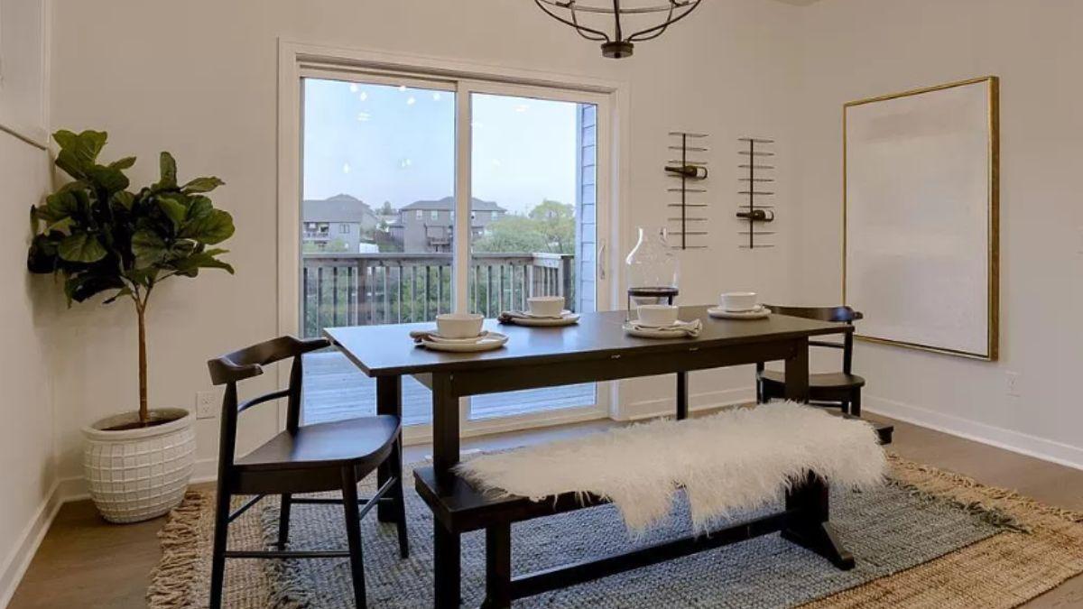 Check Out This Dining Room with Its Sleek Bench Seating and Patio View