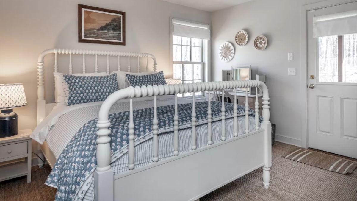Charming Bedroom with a Vintage Iron Bed and Blue Accents