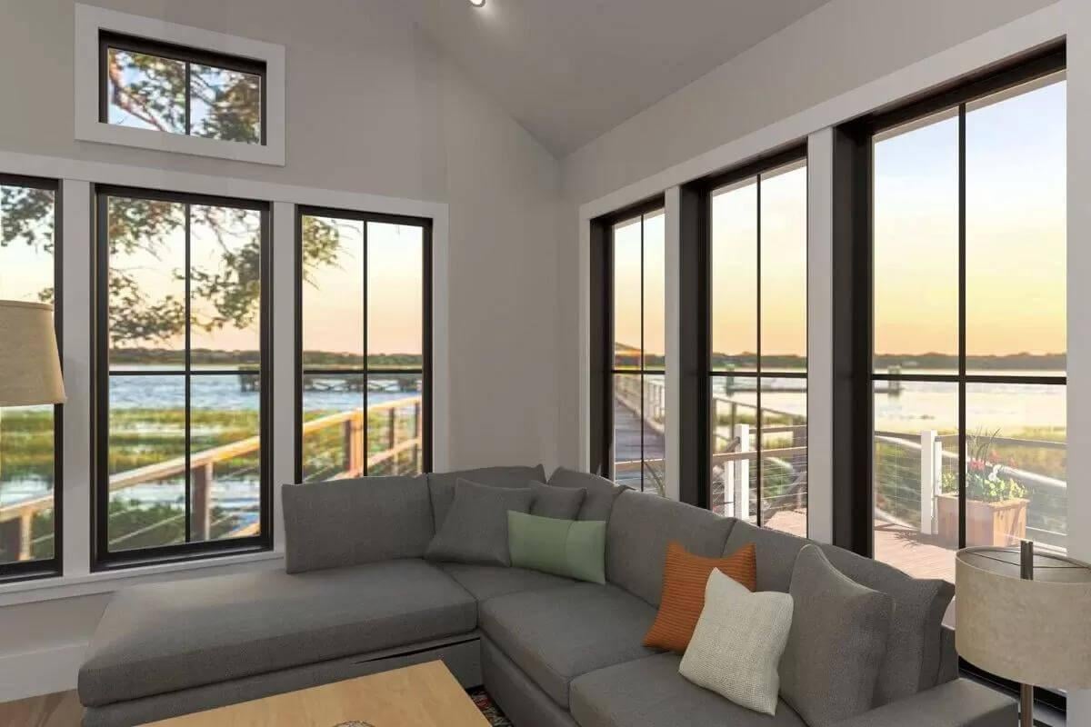 Living Room with Expansive Windows and Waterfront Views