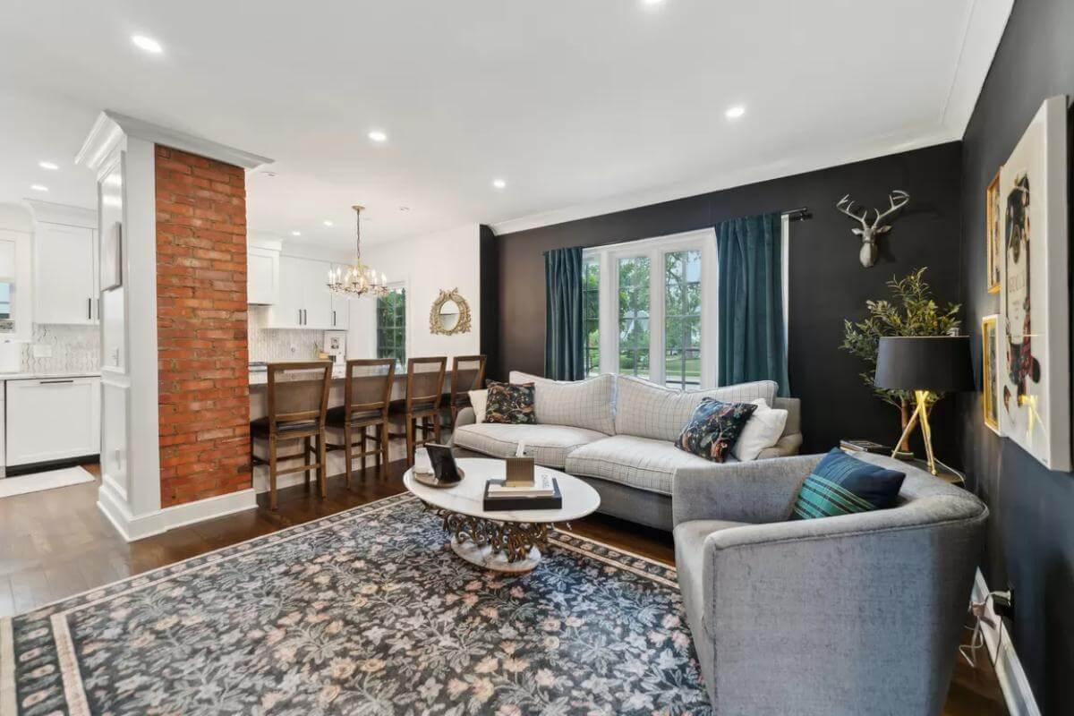 Open-Concept Living Room with Brick Feature and Elegant Dining Area