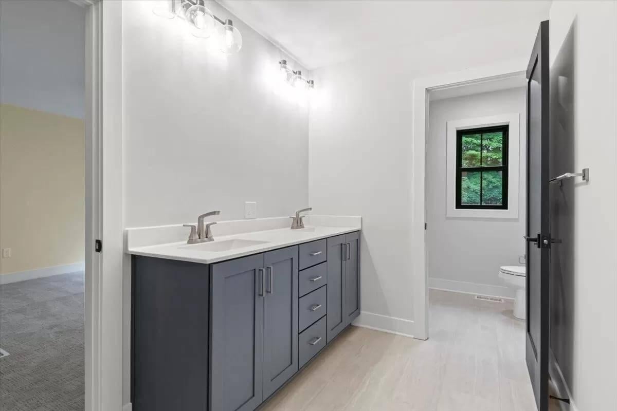 Sleek Bathroom with Double Vanity and Natural Views