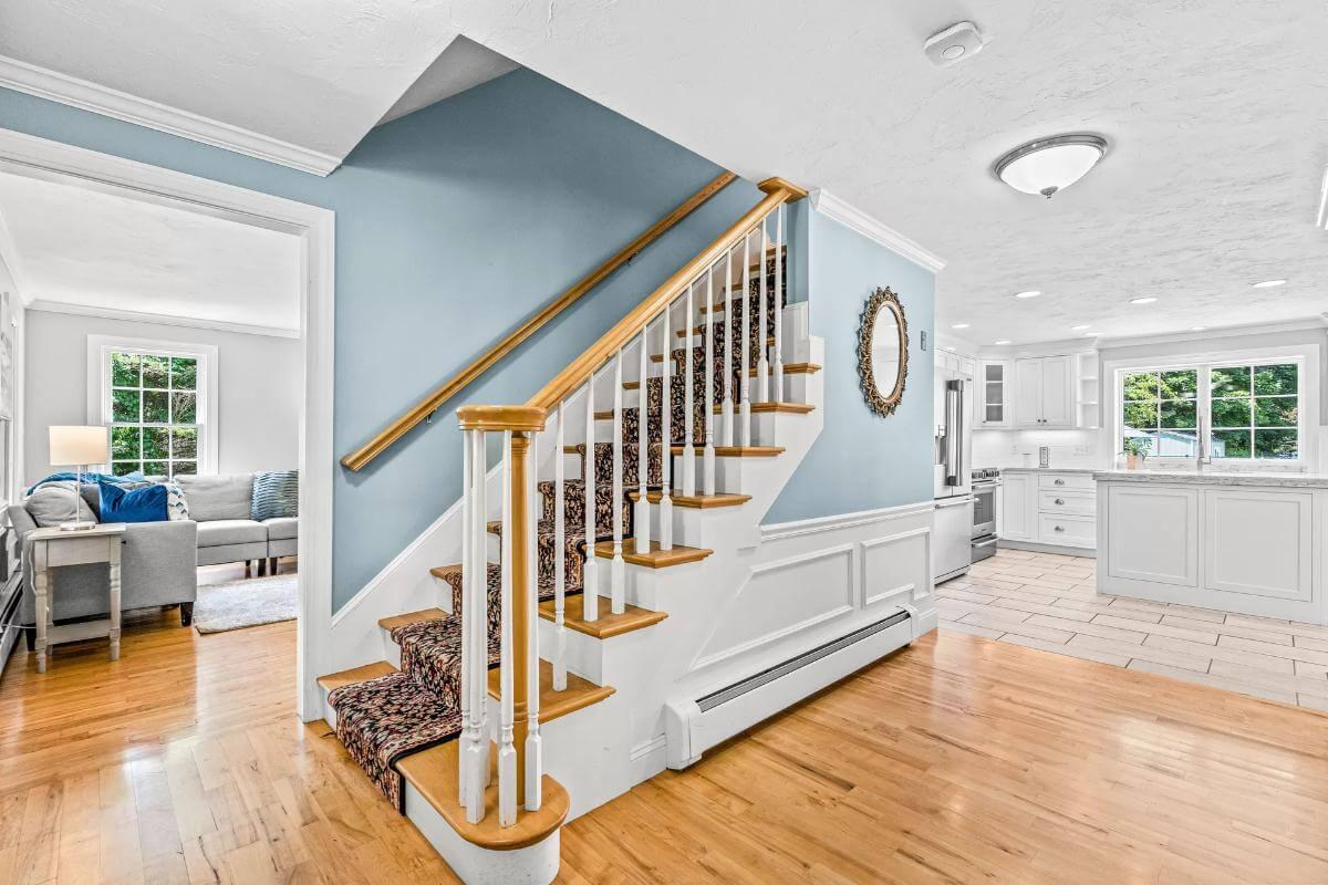 Notice the Crisp Wood Staircase Leading to Bright Living Spaces